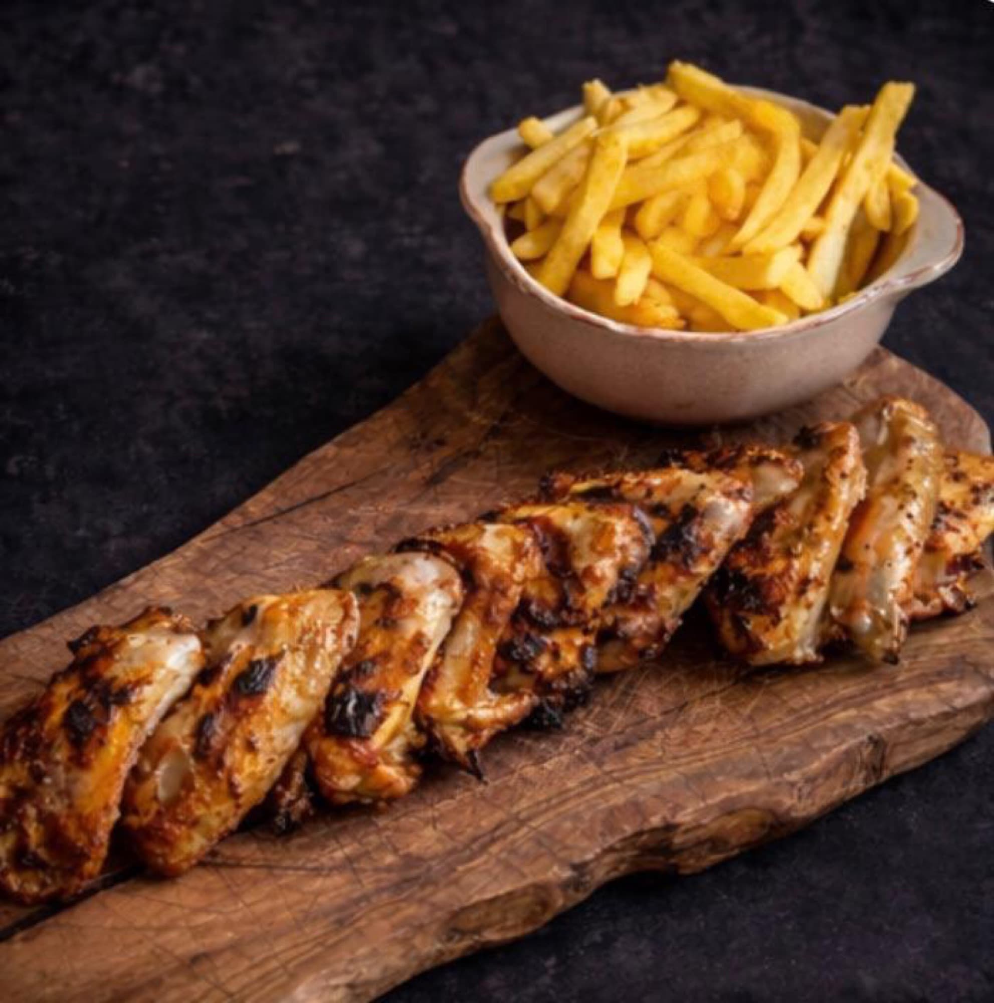 A board of charcoal-grilled piri piri chicken wings at Diego's