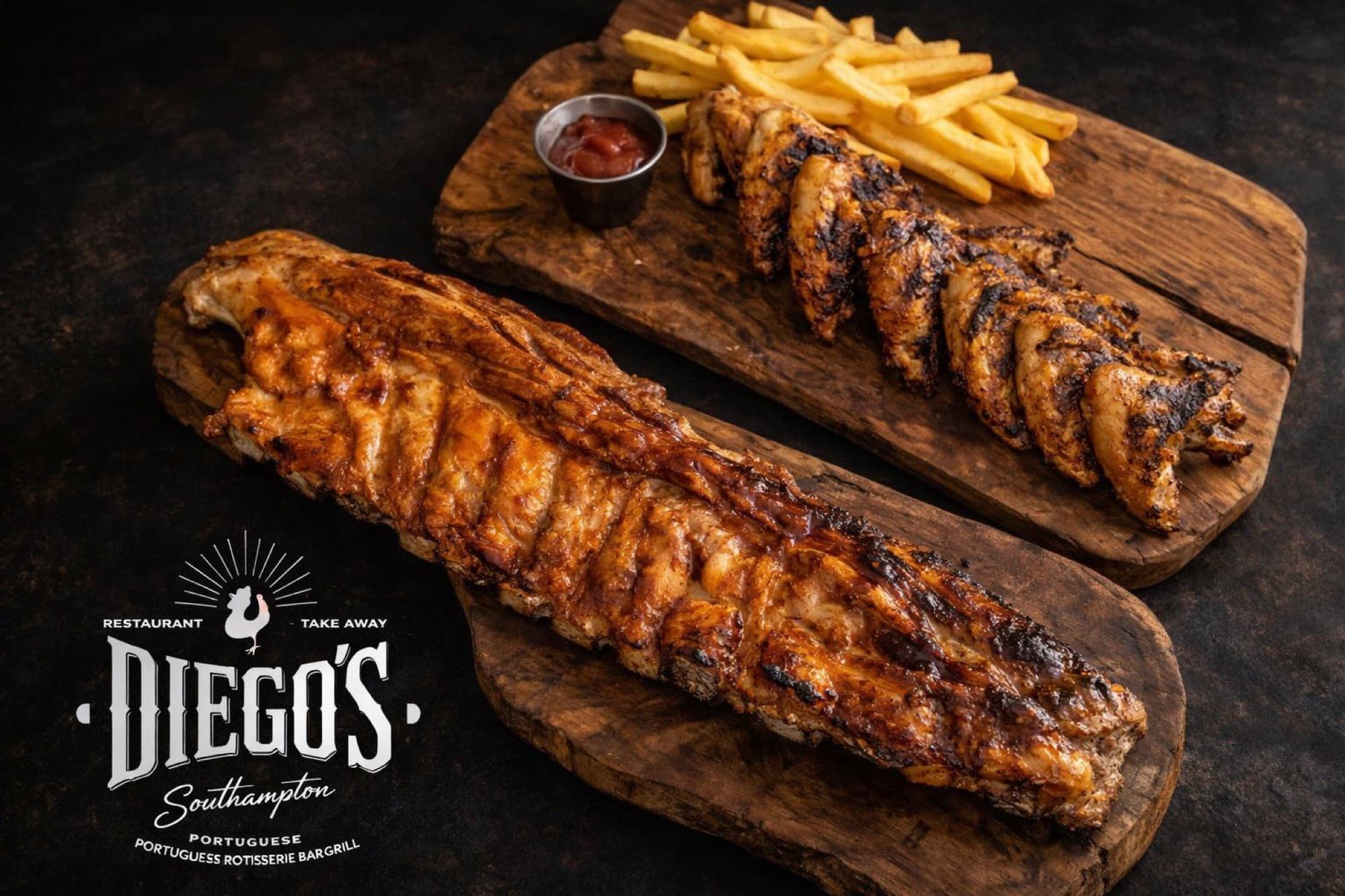 Boards of grilled chicken and pork belly with fries at Diego's
